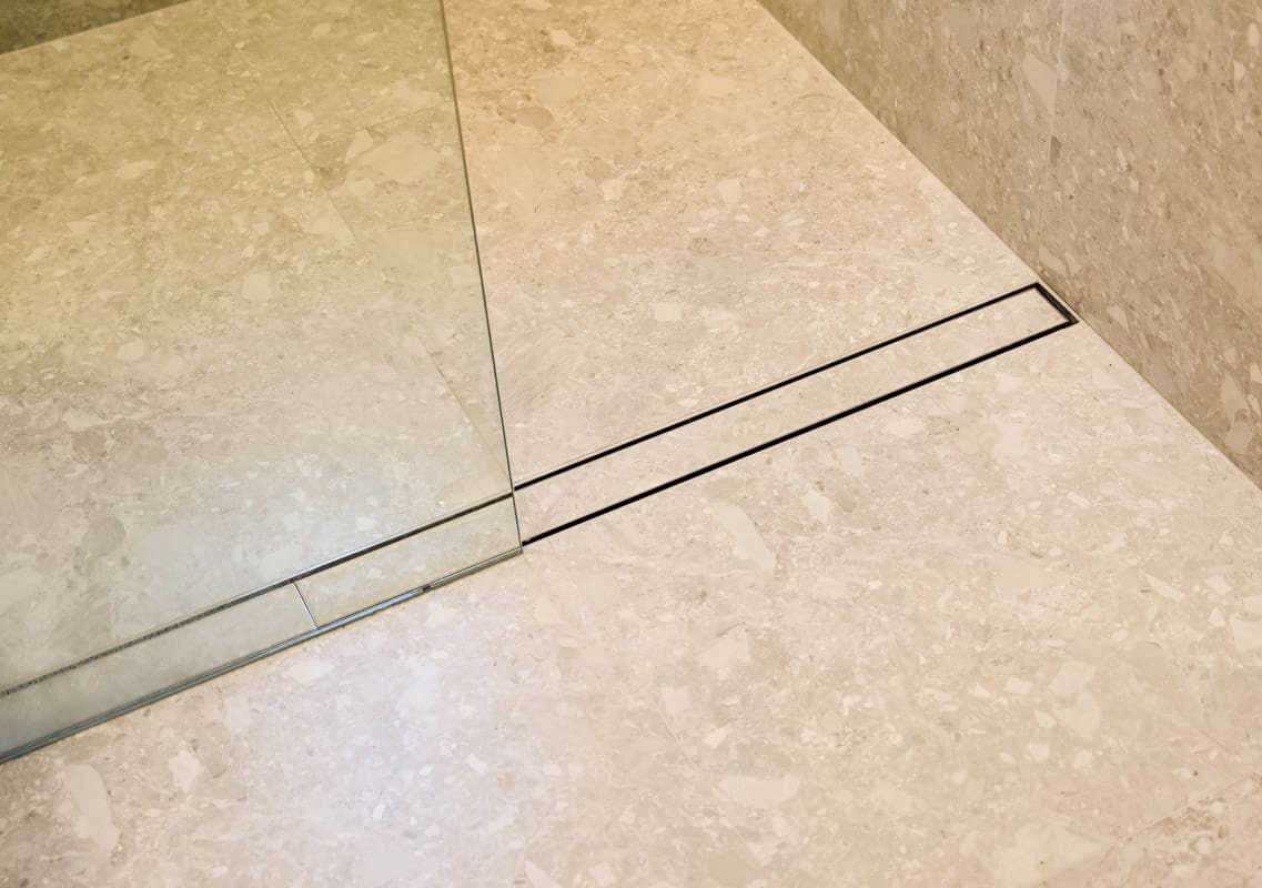 Luxury Master Bathroom Renovator in Sydney with custom steel floor drain