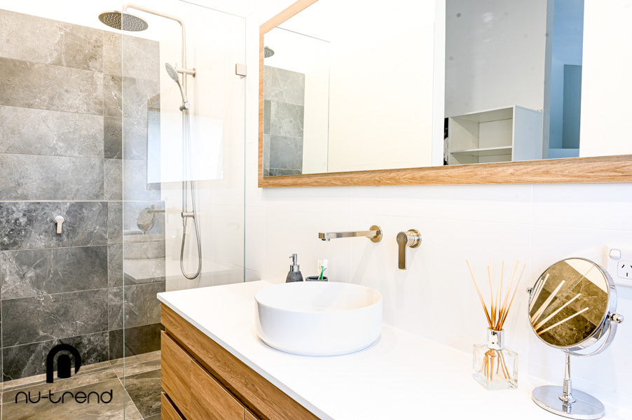 Convert a toilet to a shower in Sydney renovations by Nu Trend new vanity installed with grey feature wall