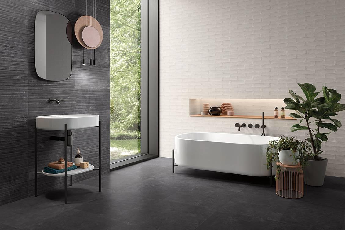 A bathroom renovation with textured tiles on the walls