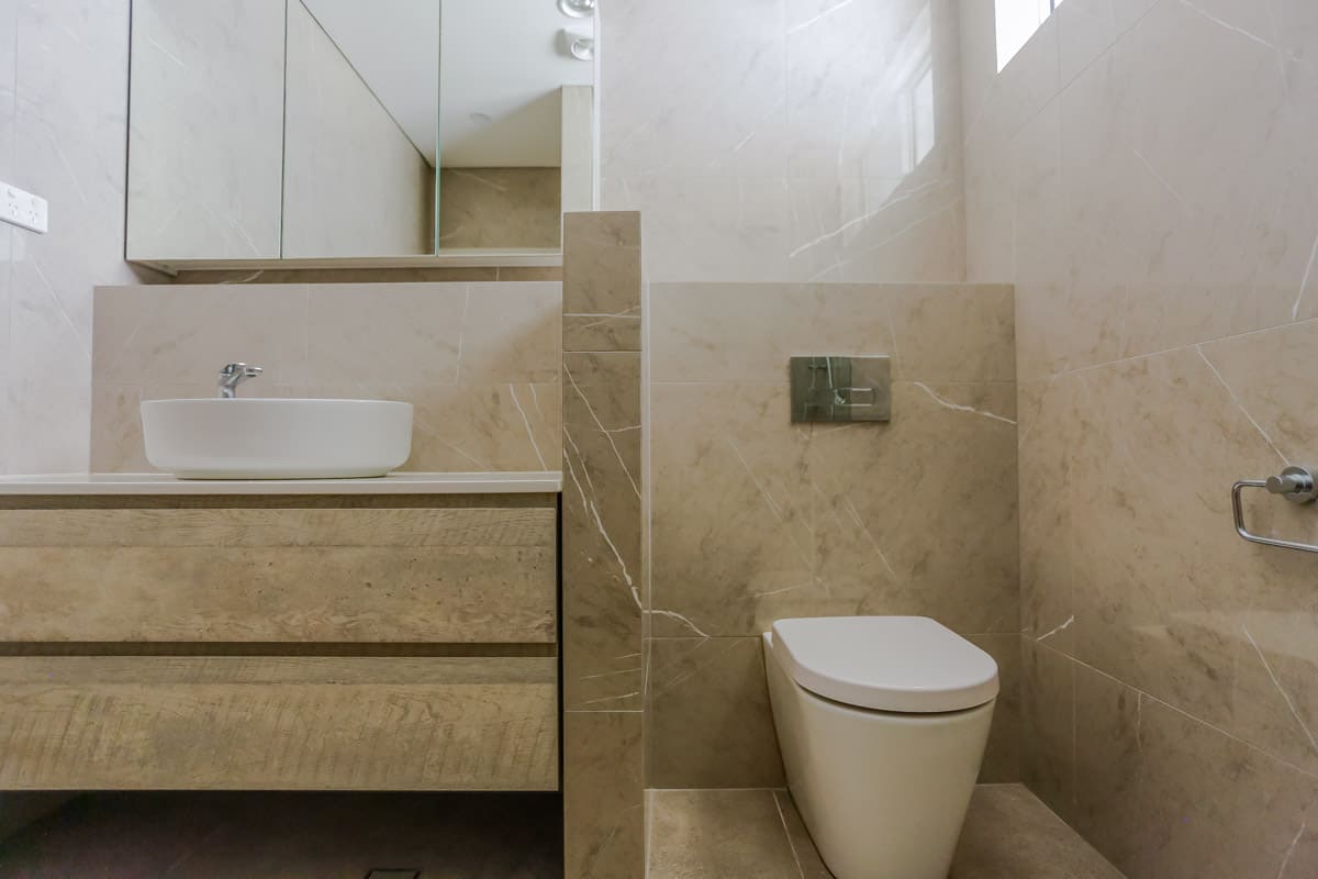 Bathroom Renovation in Sylvania Sydney with porcelain marble look tiles and Kado Lux toilet suite