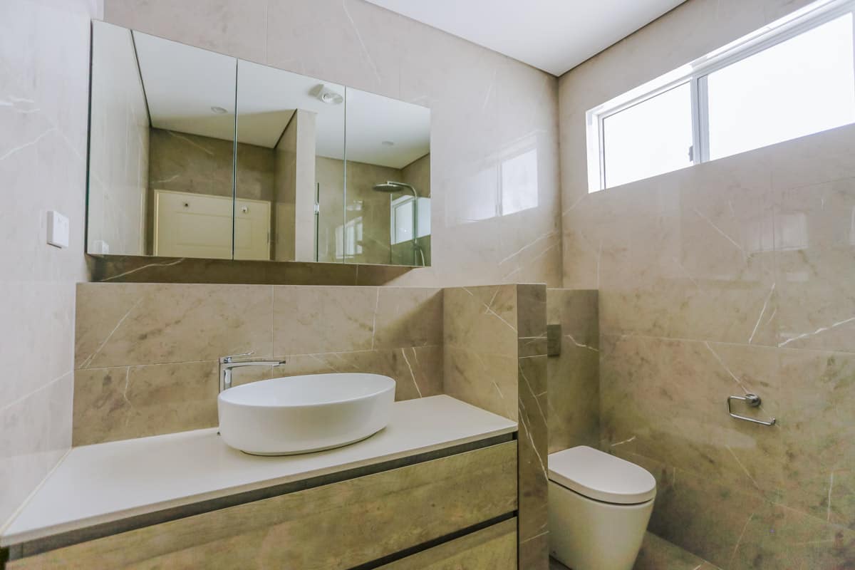 Bathroom Renovation in Sylvania Sydney with porcelain marble look tiles in beige