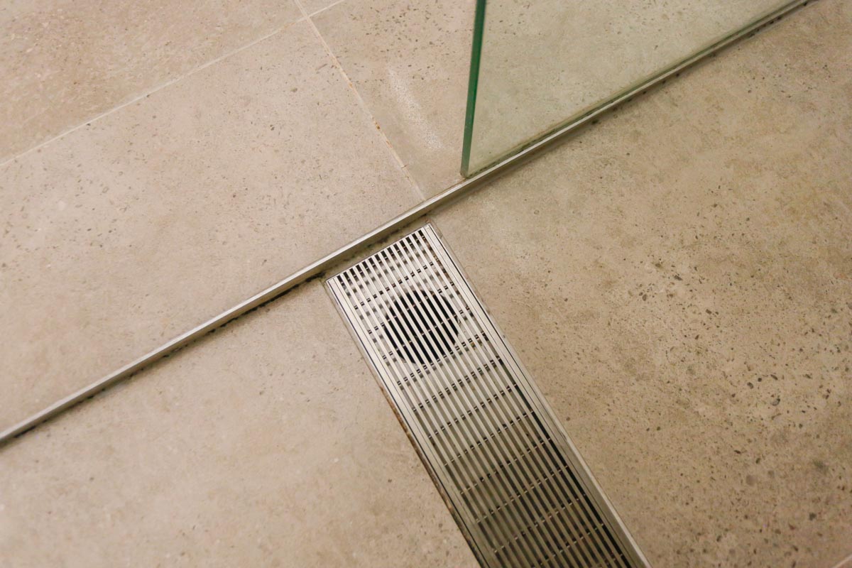 Bathroom-Renovation-in-Sylvania-Sydney-with-porcelain-marble-look-tiles-with-custom-made-drain-grate