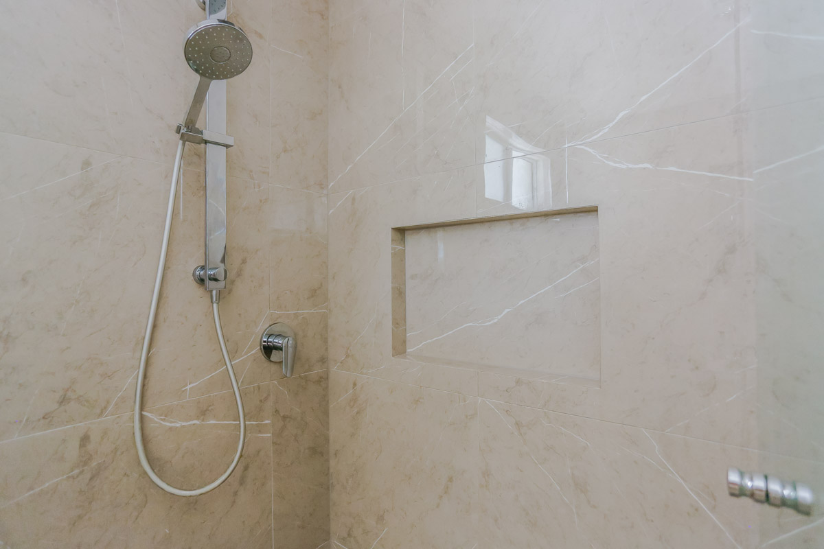 Bathroom Renovation in Sylvania Sydney with porcelain marble look tiles with wall niche