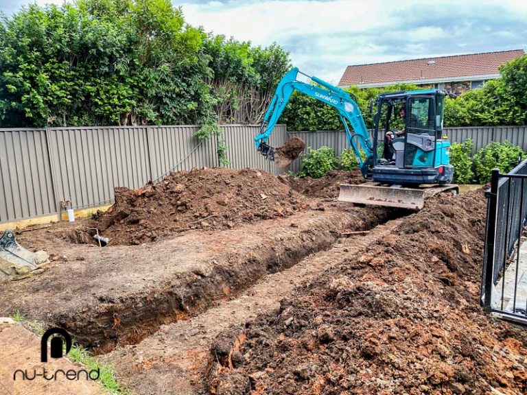 Plumber in Sydney replace illegal sewer pipe work - digging pipes up