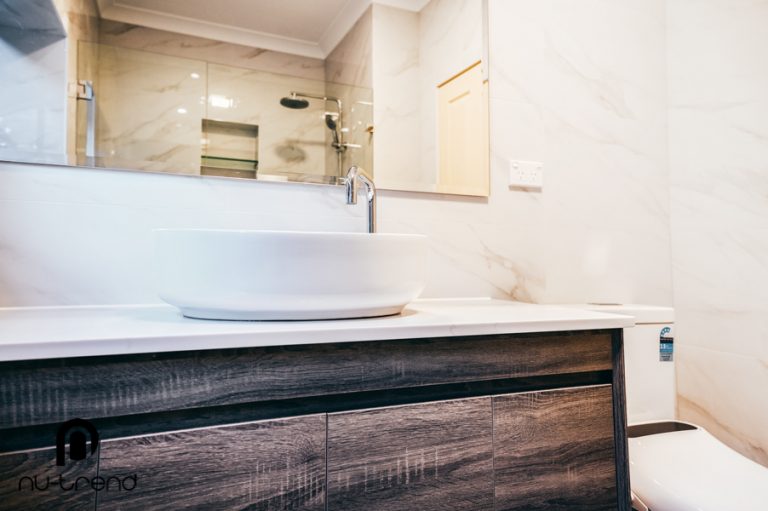 Bathroom renovation with timber look floor tiles round sink