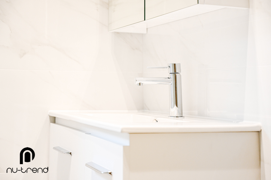 Small bathroom renovation with timber look floor tiles silver taps