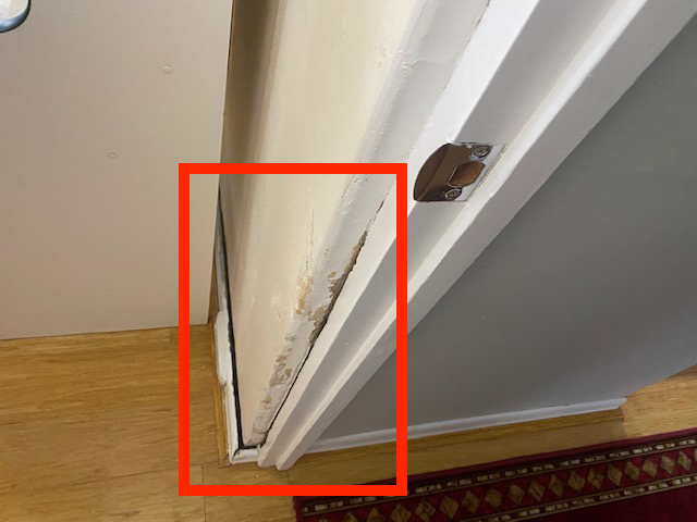 Poor-wall-and-trim-patching-around-the-door-entry-to-the-bathroom