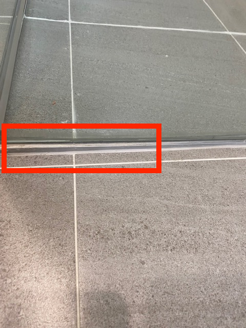 New bathroom with failed waterproofing photo Standard retail shower screen didnt fit so a ramp was built to suit the right level gradient