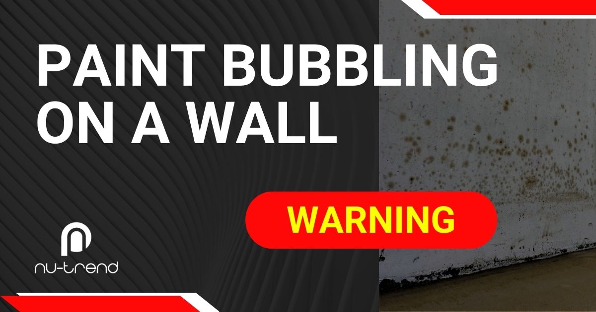 What causes paint bubbling on a wall near a bathroom?