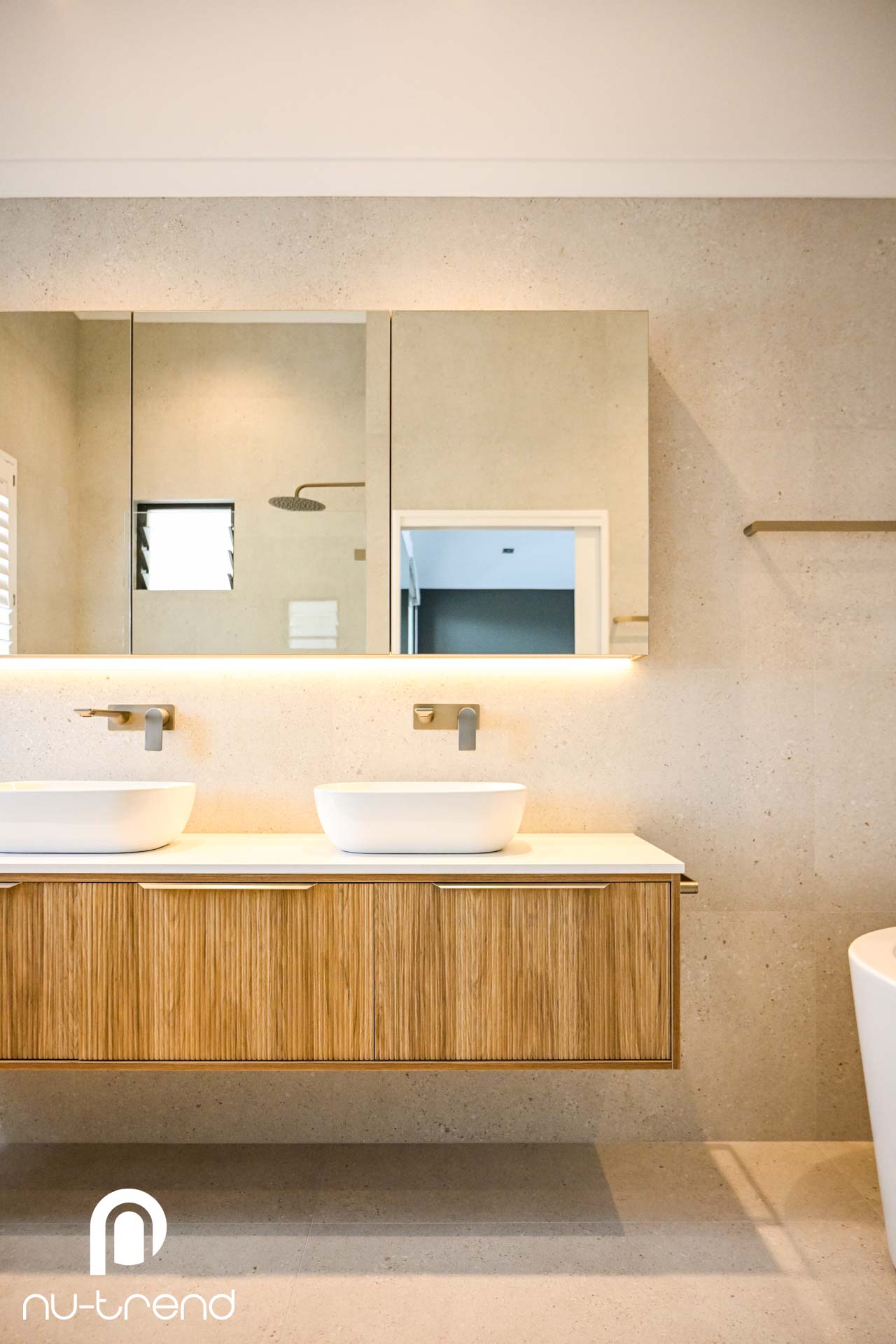 Bathroom renovation in Randwick with under mirror lighting