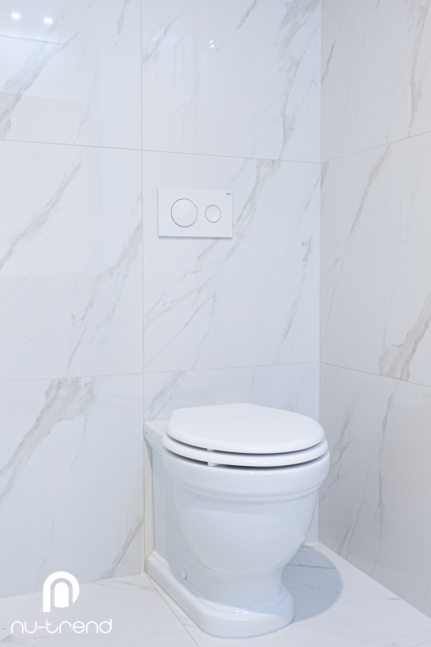 Classic contemporary bathroom with a luxury colour palette photo Main bathroom renovation in Loftus Sydney with new toilet