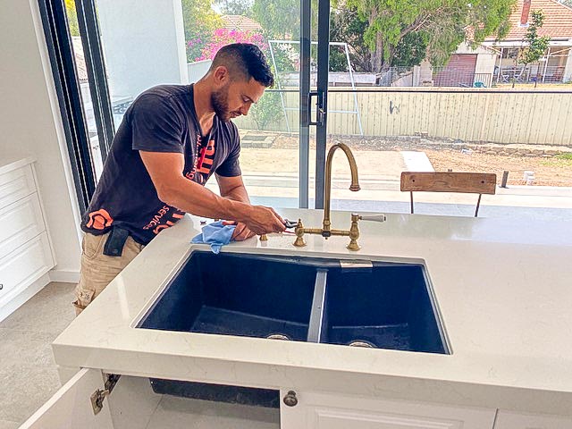 Plumber repairing Garmando Vicario Taps in the Kitchen leaking at the base