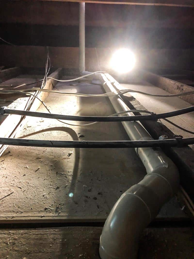 Getting a smelly toilet inspected by a plumber photo How to fix toilet smells or gurgling in a bathroom by installing proper ventilation in the roof