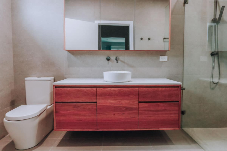 Nu Trend Small Bathroom with walk in shower designed with ABI Interiors tapware and Just In Place Spotted Gum Timber Vanity