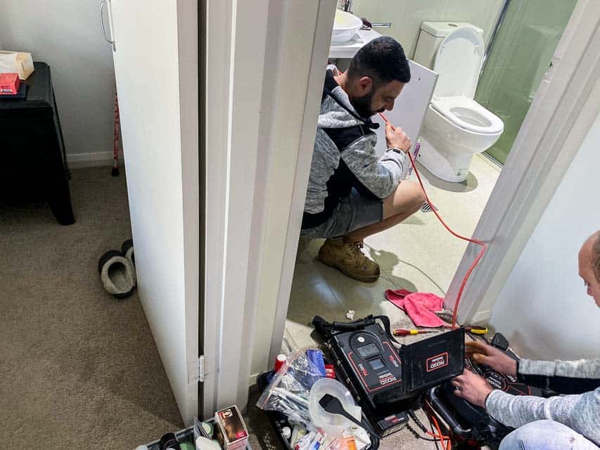Water leak detection for bathrooms in a unit Nu-Trend plumbing doing leak detection for a bathroom in a unit in Carlingford for a shower with professional equipment