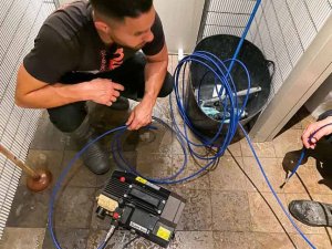 Nu-Trend plumbing fixing a blocked sewer drain in a restaurant shopping centre retail store with hot water high pressure jet blast