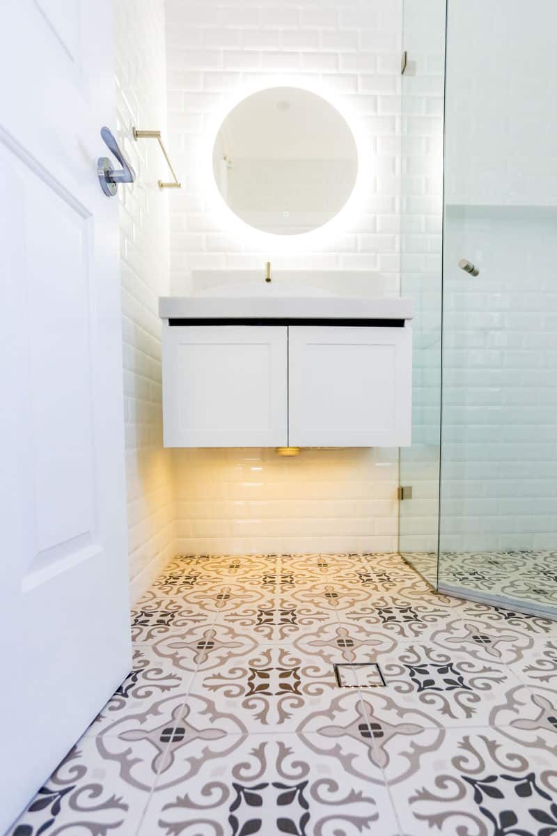 Small Bathroom Renovation Sydney with frameless shower with white London vanity from ADP and Marques Jet Gris 333x333mm floor tiles installed by Nu Trend